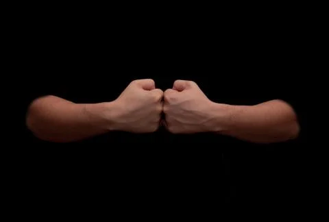 Man's hands on a black background Stock Photos