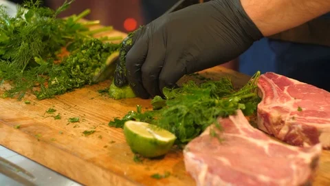 Man's hands in black gloves cutting the lime. Stock-Footage 82702350