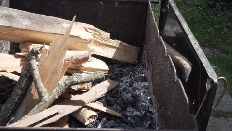 Man's hands building fire in BBQ Stock Footage 89850422