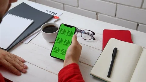 Man's Hands Close Up of Phone With Green Screen on White Office Wooden Table Stock Footage 109604503