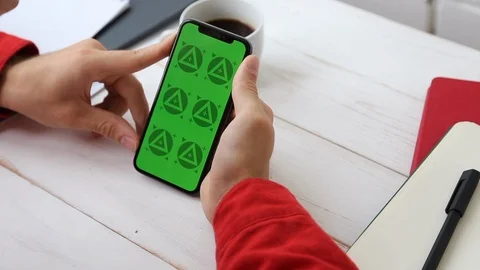 Man's Hands Close Up of Phone With Green Screen on White Office Wooden Table Stock Footage 109604566