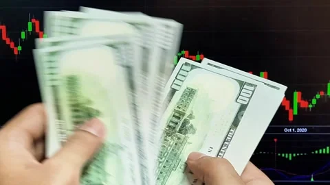 Man's hands count dollar bills on the background of a laptop Stock Footage 289200991