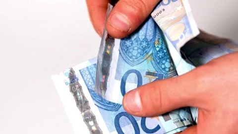 Man's hands counting the bundle of 20 euro banknotes. Money counting. Stock Footage 265885606