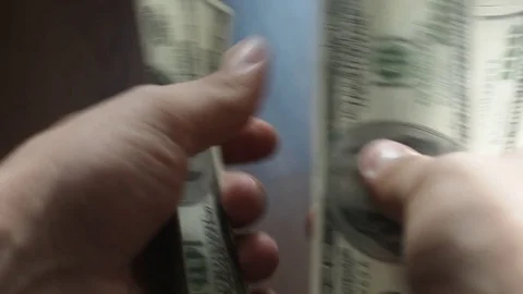 Man's hands counting hundred dollar bills Stock Footage 81132980