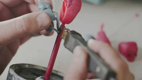 Mans hands create wax molds of skull ring for production of jewelry. Goldsmith Stock Footage 109095025
