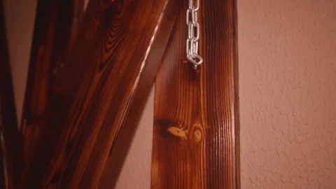 Man's hands cuff woman's hands to a wooden cross before sex. CLose up view. Stock Footage 118499068