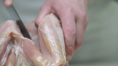 Man's hands cut chicken knife Stock Footage 68721277
