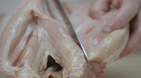 Man's hands cut chicken knife Stock Footage 68721319
