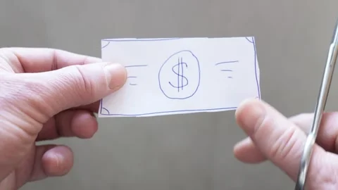 Man's hands cut paper drawn dollar with scissors. Metaphorical symbol of de.. Stock Footage 296219123