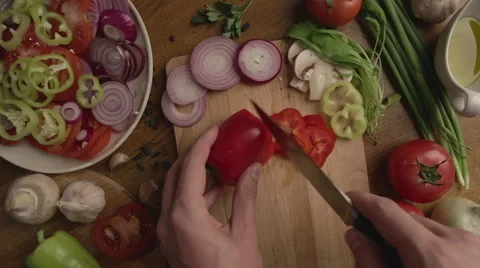 Mans hands cut pepper POV Stock-Footage 67768058