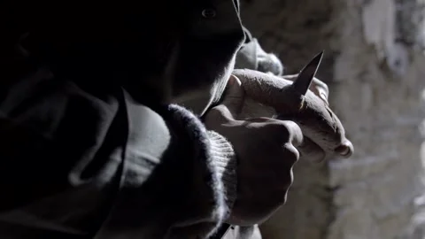 Man's hands cut a piece of bread. Backlight. Slow motion 4K 库存影片 302348687