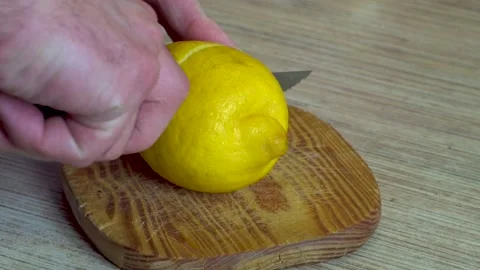 Man's hands cutting a lemon Stock-Footage 196170819