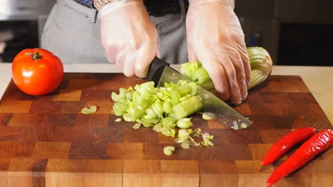 Man's hands cutting vegetables in restauran. Stock Footage 87667124