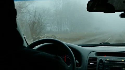 Man's hands of a driver on steering wheel of a car on asphalt road Video stock 73661686