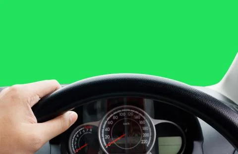 Man's hands of a driver on steering wheel of a minivan car on asphalt road,.. Stock Photos