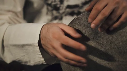 Man's hands drumming out a beat on an arabic percussion drum named Tombak Video stock 74525110