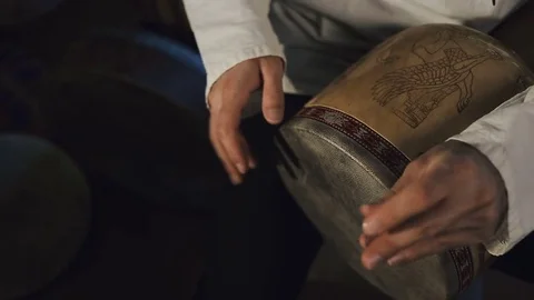 Man's hands drumming out a beat on an arabic percussion drum named Tombak Video stock 74525166