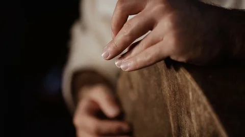Man's hands drumming out a beat on an arabic percussion drum named Bendir Vídeos de archivo 74525393