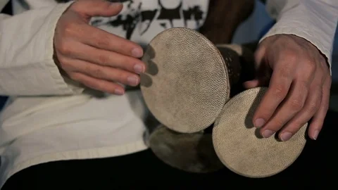 Man's hands drumming out a beat on an arabic percussion drum named Kasoureh Video stock 74526666