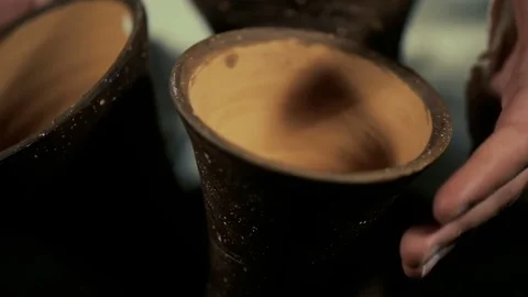 Man's hands drumming out a beat on an arabic percussion drum named Kasoureh Video stock 74527038