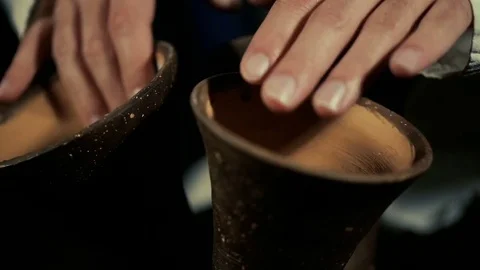 Man's hands drumming out a beat on an arabic percussion drum named Kasoureh Video stock 74527097