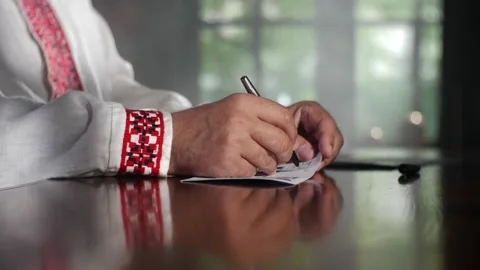 The man's hands fill the fields on the envelope letter Stock Footage 156665253