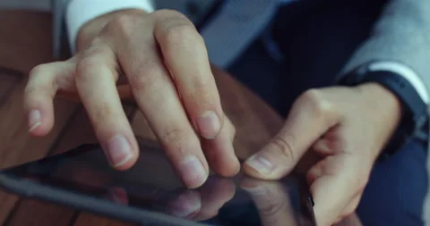 A man's hands filmed almost using the tablet, surfing the internet. Stock Footage 139206369