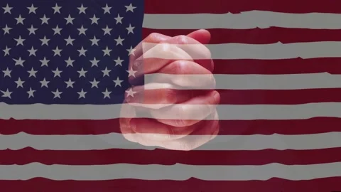 Man's hands in foreground with American Flag in the wind. Stock Footage 224926131