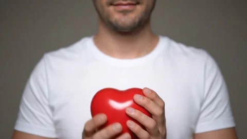 Man's Hands Forming a Heart Shape at Sunset Stock Footage 314805446