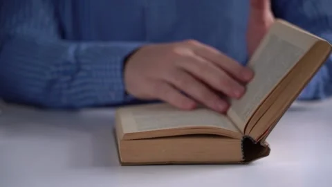 Man's Hands Gently Close the thick Book. Finish Reading a Literary Book Stock Footage 150041202