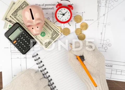 Mans hands in gloves with pencil on draft Stock Photos