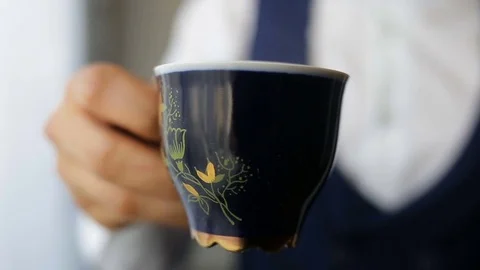 Man's hands holding cup of coffee Stock Footage 84113994