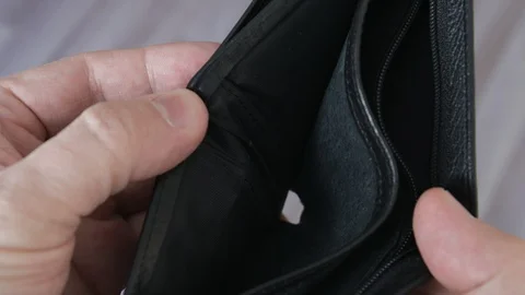 Man's hands holding empty wallet. Poverty or bankruptcy concept Stock Footage 129312638