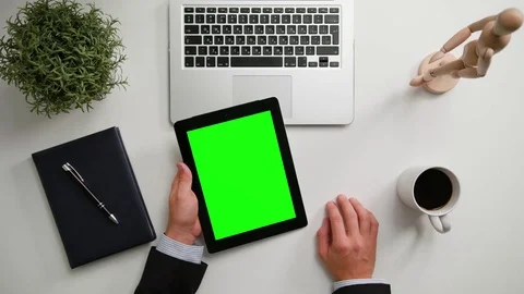 A Man's Hands Holding an i-Pad with a Green Screen 스톡 동영상 83716355