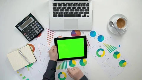 A Man's Hands Holding an i-Pad with a Green Screen Stock Footage 84178181