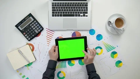 A Man's Hands Holding an i-Pad with a Green Screen Stock Footage 84294576