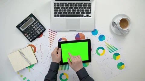 A Man's Hands Holding an i-Pad with a Green Screen Stock Footage 84299676