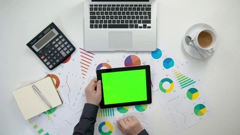 A Man's Hands Holding an i-Pad with a Green Screen Stock Footage 84302230