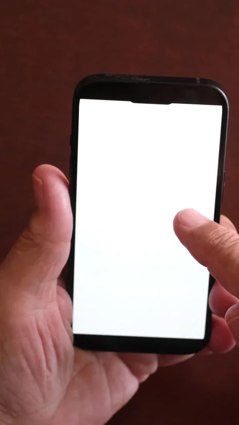 Man's hands holding a modern black smartphone with a blank white display Stock Footage 344389649