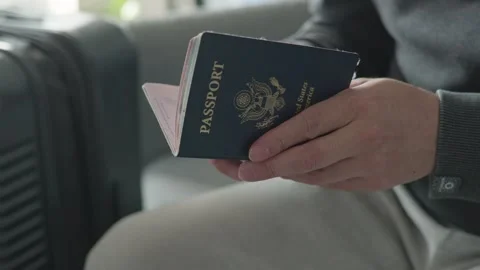 Man's hands holding US Passport Stock Footage 260448341