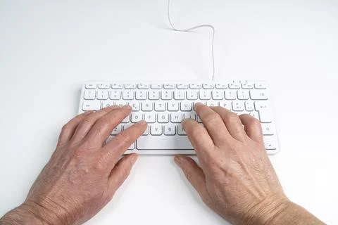 A man's hands on a keyboard Stock Photos