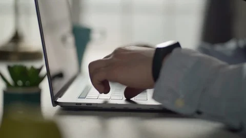 Man's hands on laptop while working 库存影片 127413220