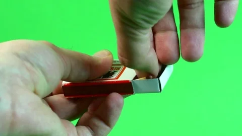 Man's Hands Lighting A Match On Green Screen Vídeo Stock 73784901