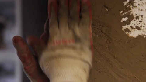 Man's hands line the corner of the wall Stock Footage 122702611