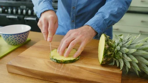 Man's Hands Man Cutting The Rind From Fresh Pineapple Slice Stock Footage 86072595