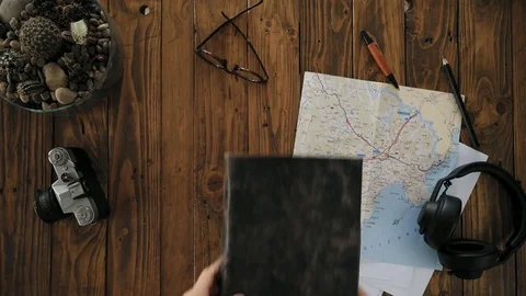 Mans hands open handmade a4 notebook with real leather cover Stock Footage 80557084