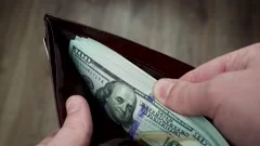 One Hundred And Fifty Dollar Bills Spread Out In A Fan Stock Photo