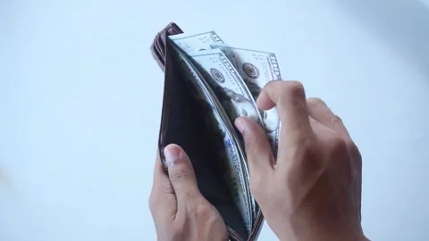 The man's hands open a wallet filled with one hundred dollar bills. Stock Footage 322159484