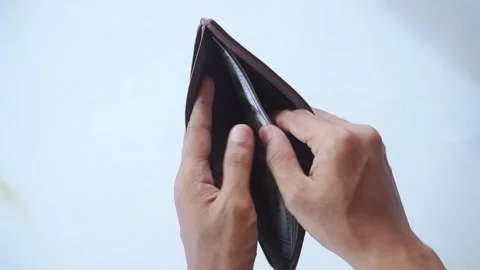 The man's hands open a wallet filled with one hundred dollar bills. Stock Footage 322159522
