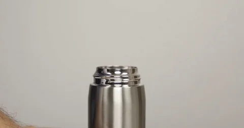 Man's hands opening thermos Stock Footage 83911695